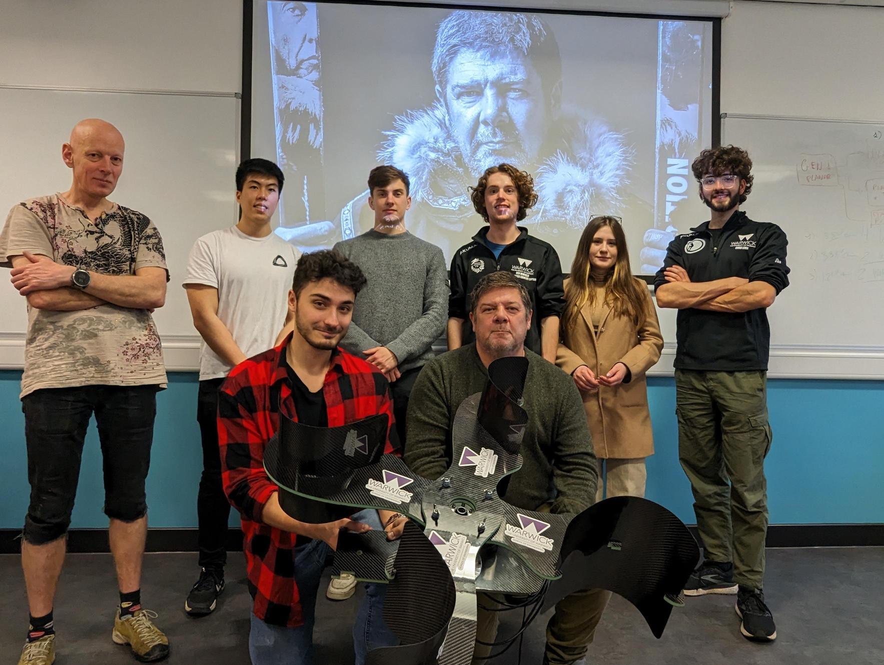 Warwick students hand over the wind turbine to explorer Mark